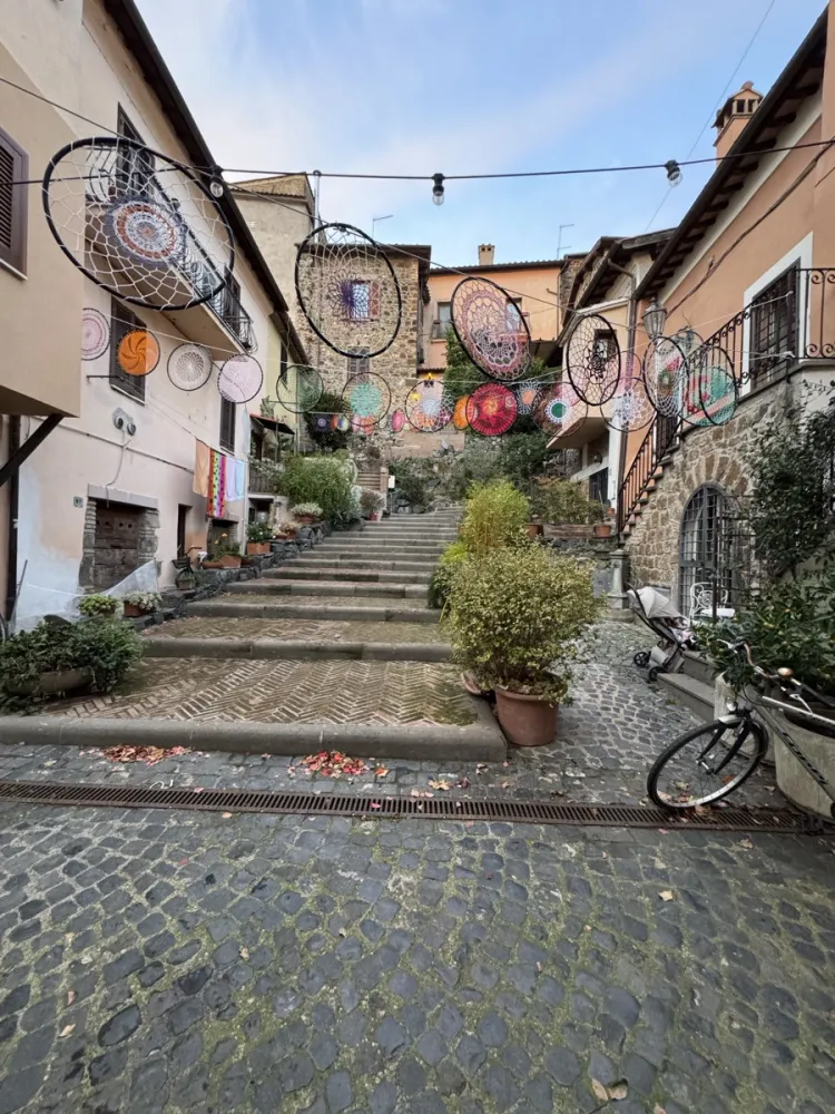 Charming alley in Trevignano Romano village with colourful dreamcatchers